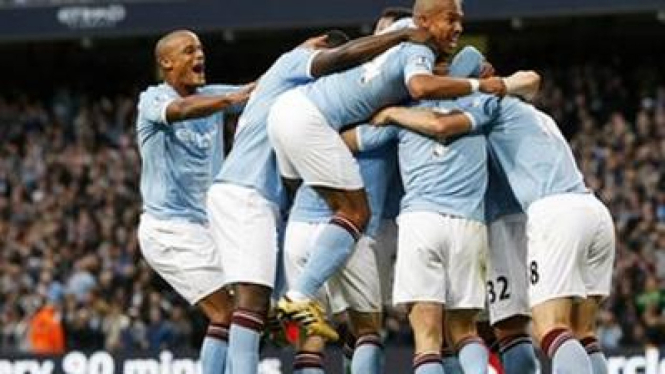 Pemain Manchester City merayakan gol