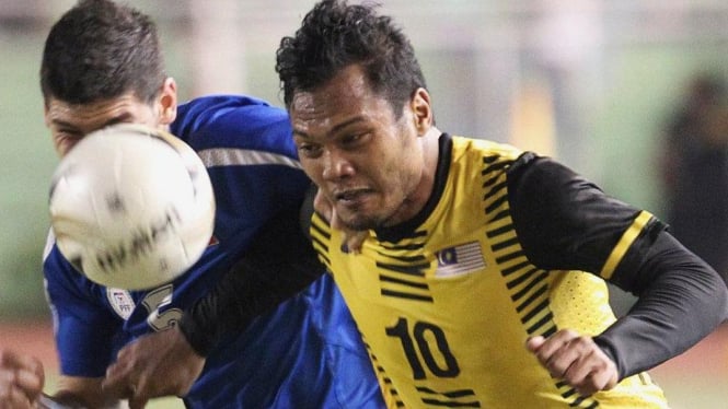 Striker Malaysia, Mohd Safee Sali (kuning), saat melawan FIilipina