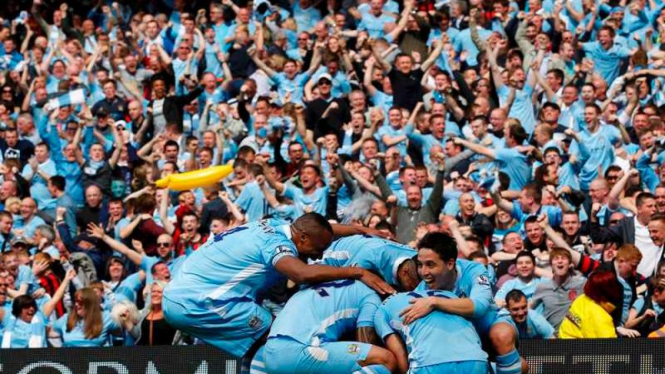 Pemain Manchester City saat merayakan gol pertama ke gawang QPR