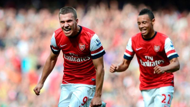 Penyerang Arsenal, Lukas Podolski, usai membobol gawang Southampton