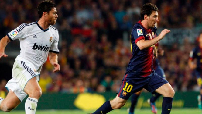Lionel Messi dibayangi Xabi Alonso
