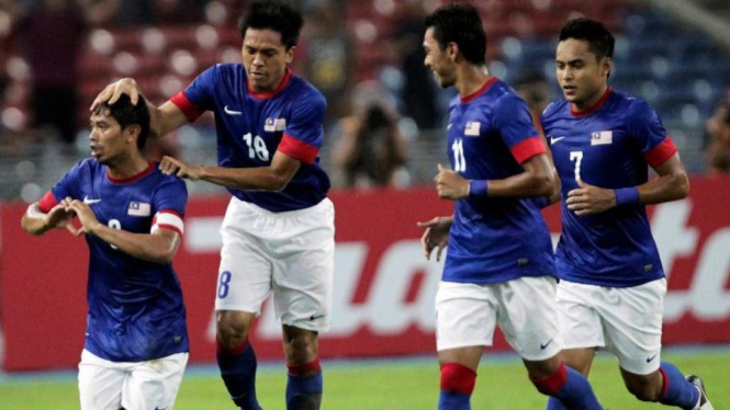 Pemain Malaysia merayakan gol lawan Laos