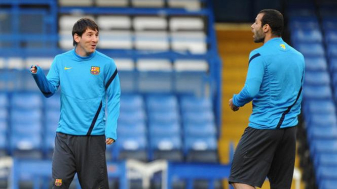 Lionel Messi (kiri) dan Javier Mascherano
