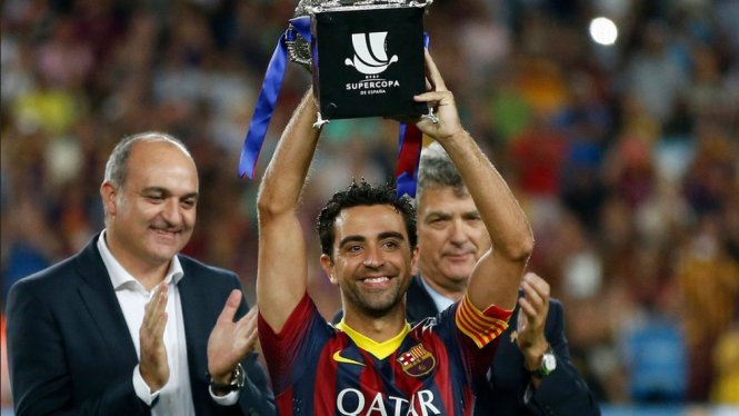 Xavi Hernandez saat Barcelona juara Piala Super Spanyol