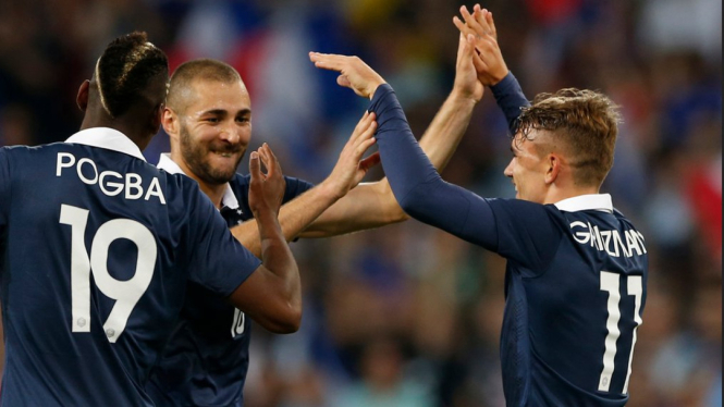 Karim Benzema, Paul Pogba dan Antoine Griezmann merayakan gol
