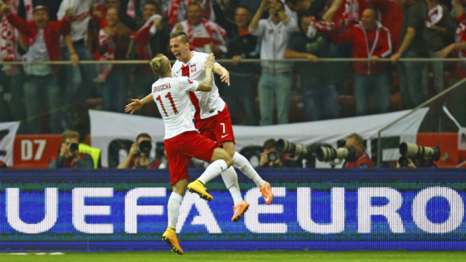 Pemain Polandia merayakan gol ke gawang Jerman di kualifikasi Piala Eropa 2016