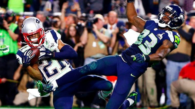 New England Patriots, Malcolm Butler, saat memotong bola di Super Bowl.