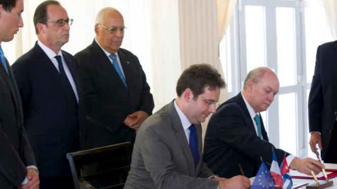 Presiden Prancis Francois Hollande bertemu pengusaha Kuba dan Prancis di Havana.