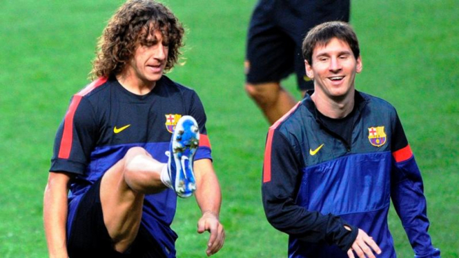 Carles Puyol dan Lionel Messi 