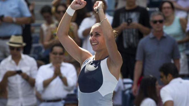 Flavia Pennetta merayakan kemenangan atas Petra Kvitova di US Open.