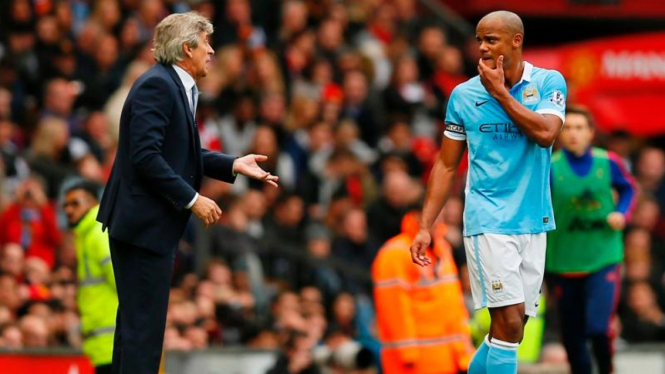 Manuel Pellegrini (kiri) dan Vincent Kompany