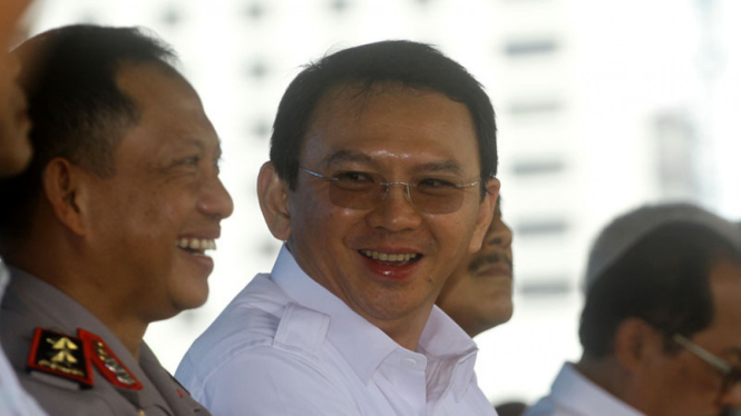Gubernur DKI Jakarta Basuki Tjahaja Purnama bersama Tito Karnavian saat menjabat Kapolda Metro Jaya.