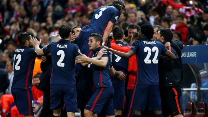 Para pemain Atletico Madrid merayakan kemenangan di Liga Champions.