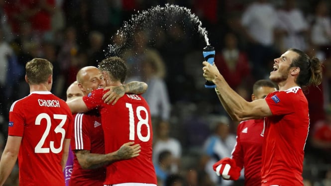 Timnas Wales merayakan kemenangan saat melawan Rusia di Piala Eropa 2016.