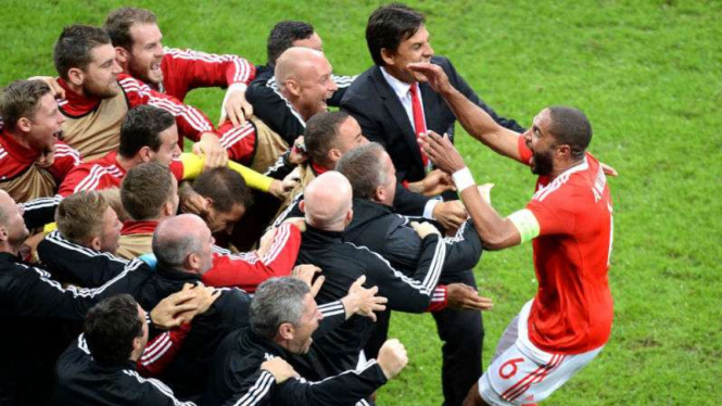 Kapten Wales Ashley Williams rayakan gol ke gawang Belgia