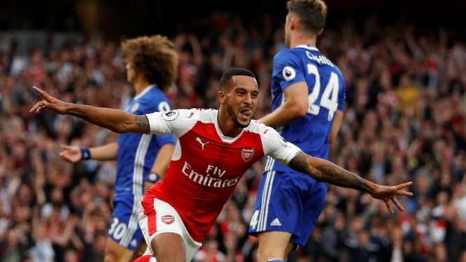 Selebrasi pemain Arsenal, Theo Walcott, usai bobol gawang Chelsea