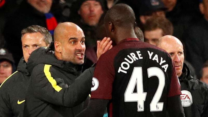 Manajer ManCity, Pep Guardiola (kiri) dan Yaya Toure (kanan)