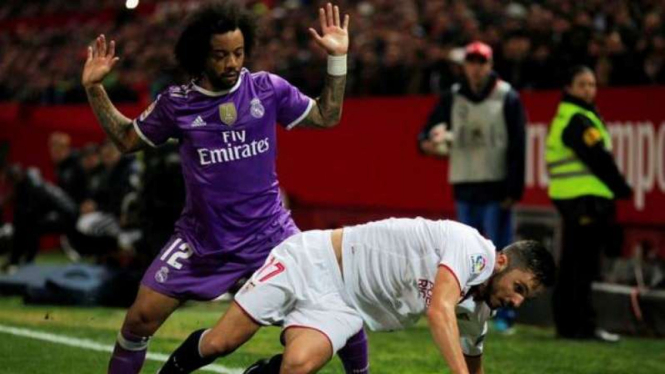 Marcelo (kiri) jadi pembelian tersukses Real Madrid di bursa transfer musim dingin.