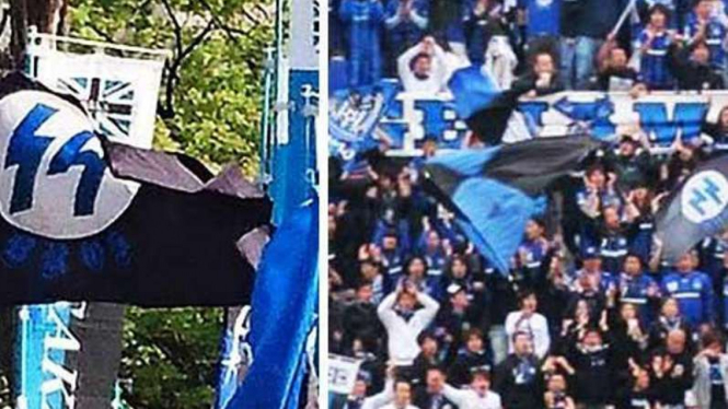 suporter Gamba Osaka membawa bendera simbol Nazi