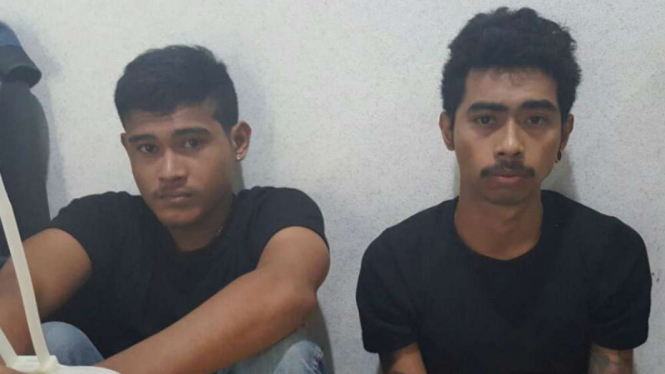 Erick Birahy dan Richard Patipelu, tersangka pembacok Hermansyah saat ditangkap polisi.