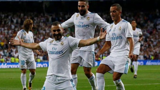 Pemain Real Madrid rayakan gol.