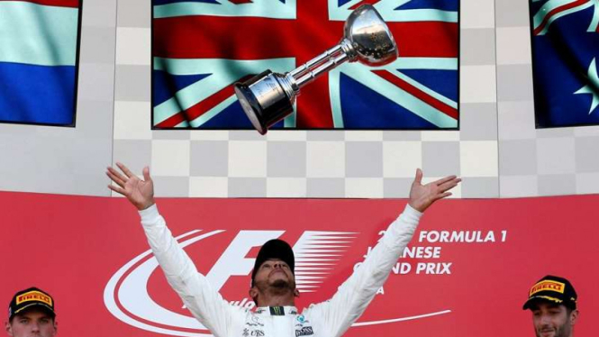 Lewis Hamilton saat merayakan juara di GP Jepang