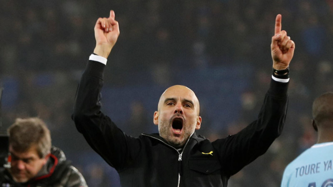 Manajer Manchester City, Pep Guardiola, merayakan kemenangan tim asuhannya