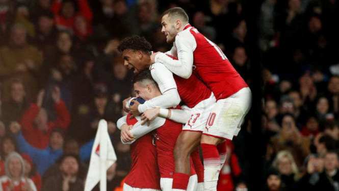 Pemain Arsenal rayakan gol 