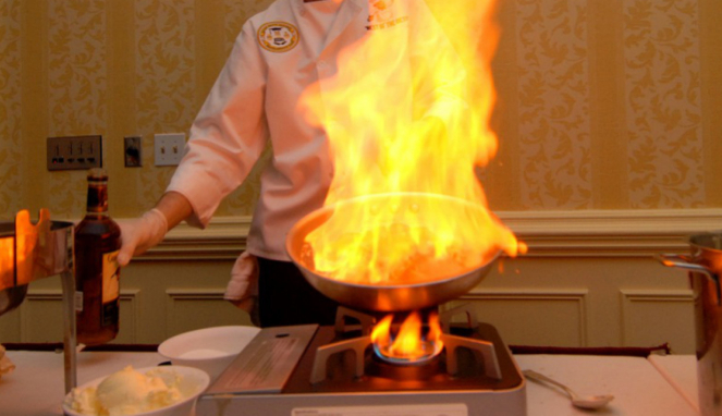 Ilustrasi memasak flambe.