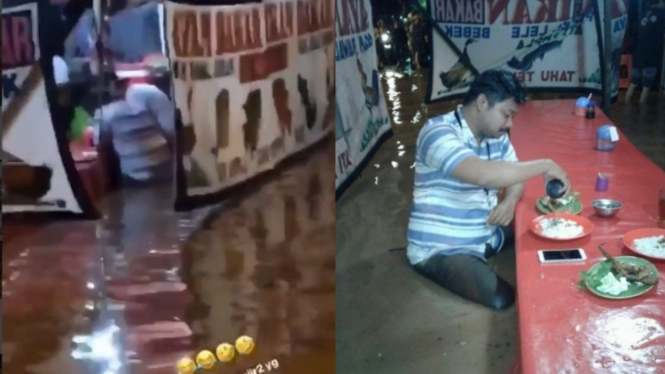 Pria makan di tengah banjir