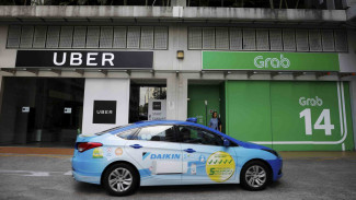 Akuisisi Grab-Uber Kena Semprit, Janji Tarif Tak Naik