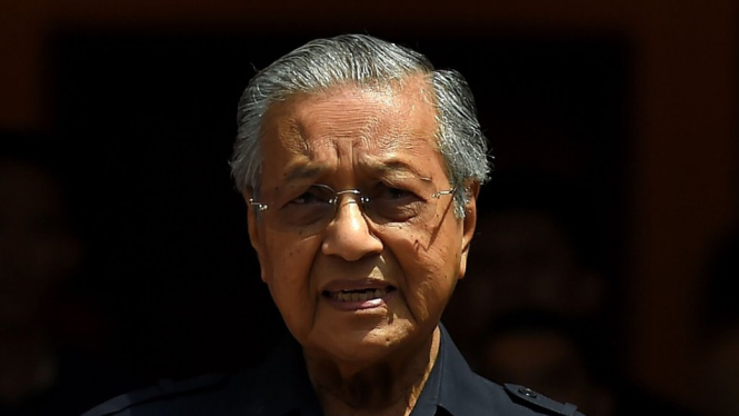 Mahathir Mohamad berjanji untuk mengupayakan agar Anwar Ibrahim mendapat pengampunan penuh dari raja sehingga ia dapat terjun langsung ke politik. - MANAN VATSYAYANA/AFP