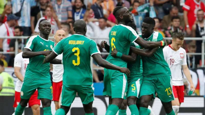 Para pemain Timnas Senegal merayakan kemenangan atas Polandia