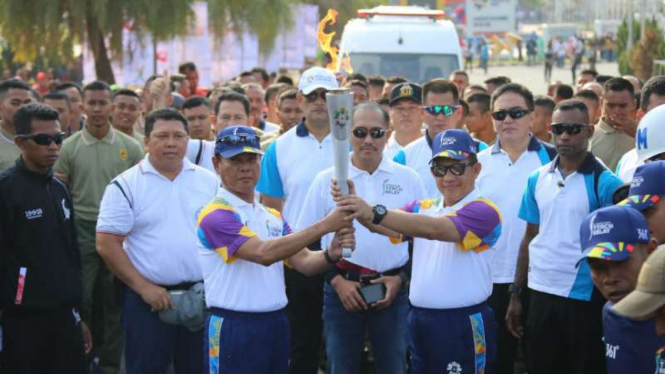 Kirab api obor Asian Games diarak di Kota Palembang, Sumsel.