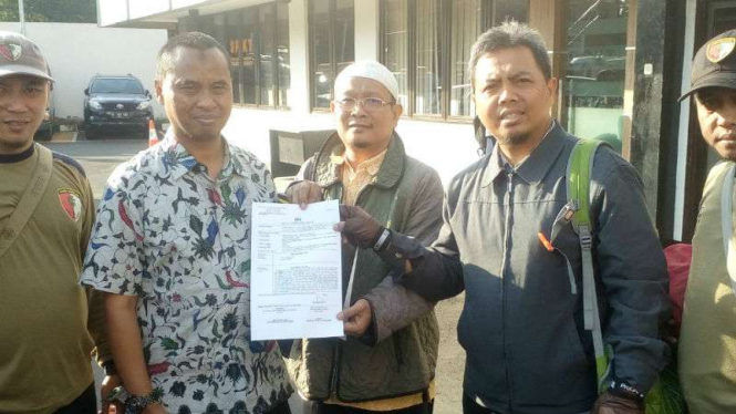 Perwakilan PKS melaporkan fitnah ke Polres Depok.
