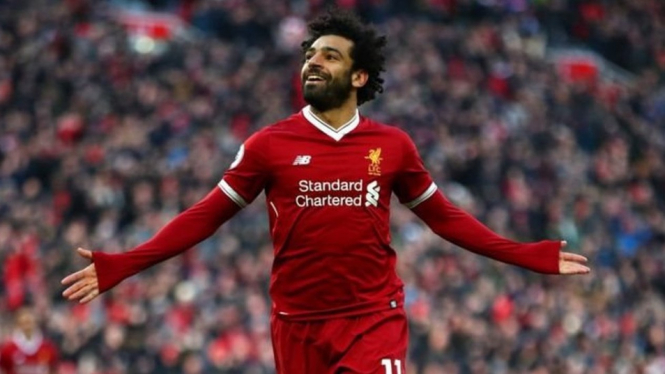 Gaya Mo Salah setelah mencetak gol. -Getty Images