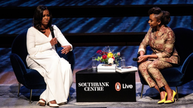 Michelle Obama speaks with Nigerian author Chimamanda Ngozi Adichie at London`s Southbank Centre - Getty Images