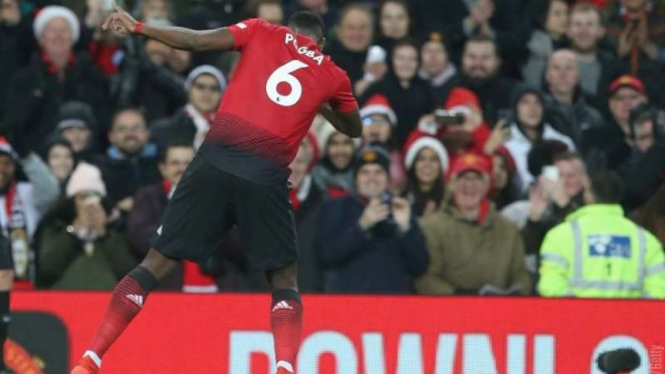 Gelandang Manchester United, Paul Pogba, melakukan selebrasi usai mencetak gol