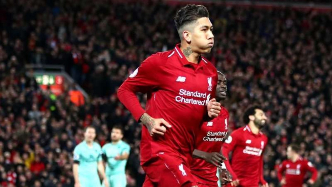 Penyerang Liverpool, Roberto Firmino usai menjebol gawang Arsenal.