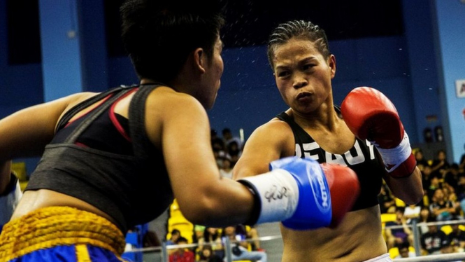 The gold belt match saw Huang face Thailand`s Jarusiri Rongmuang. - Reuters