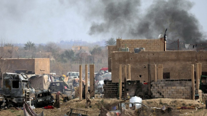 Baghouz, desa terakhir yang dikuasai ISIS sebelum direbut. Banyak anggota ISIS yang sekarang diadili di Irak.-Reuters