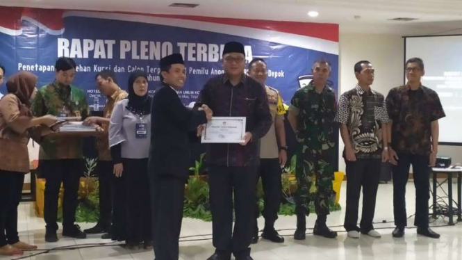 Rapat pleno terbuka penetapan perolehan kursi dan calon terpilih hasil pemilu 2019 untuk DPRD Kota Depok, Jawa Barat, Minggu, 28 Juli 2019.