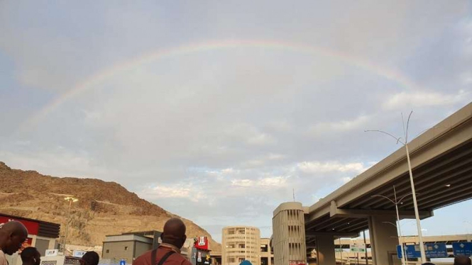 Rainbow in the sky of Mina, Mecca, Saudi Arabia.