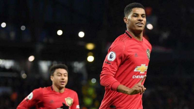 Penyerang Manchester United, Marcus Rashford, melakukan selebrasi