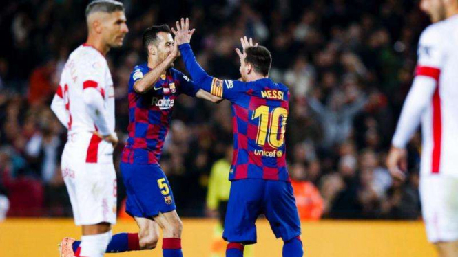 Megabintang Barcelona, Lionel Messi, merayakan golnya ke gawang Real Mallorca