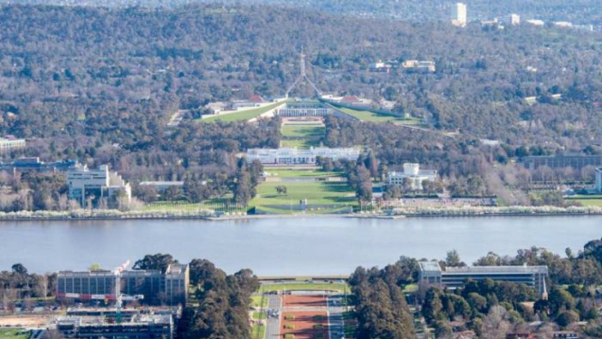 View of Anzac Parade, the lake and Parliamentary Triangle from the top of Mt Ainslie Canberra. September 2016.