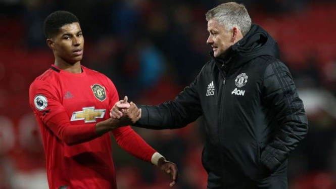 Manajer Manchester United, Ole Gunnar Solskjaer (kanan) dan Marcus Rashford