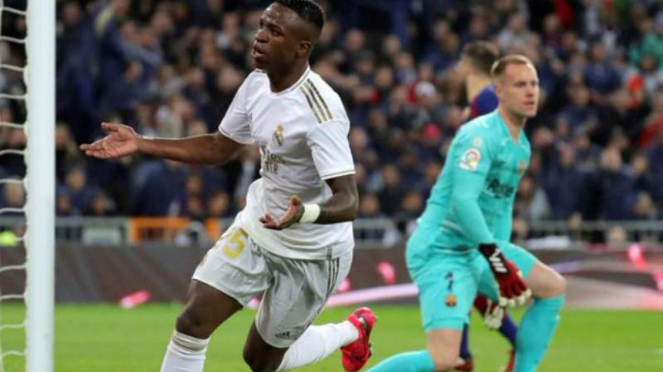 Striker Real Madrid, Vinicius Junior rayakan gol.