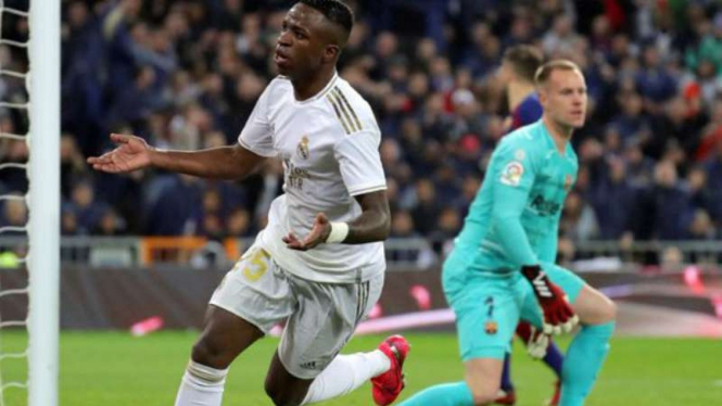 Striker Real Madrid, Vinicius Junior rayakan gol.