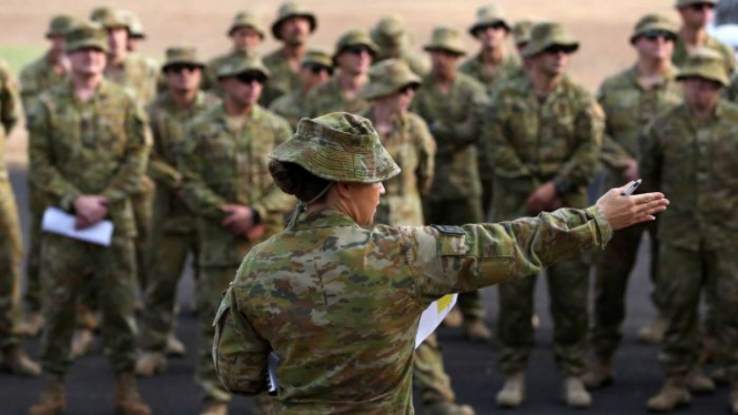 Australian Army Reserve and Regular personnel are seen during a roll call ahead of departing the Holsworthy Barracks to support bushfire efforts across NSW, in Sydney, Sunday, January 5, 2020.